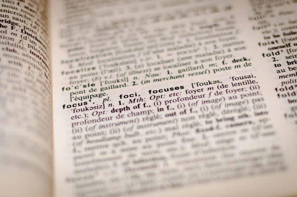 A dictionary with word "focus" in focus.